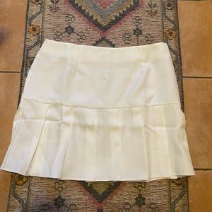 Large pleated skirt with zipper on side. NEVER WORN! NEW WITH TAGS!